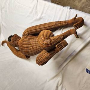 lot 295 image: Vintage MCM Wicker Hanging Monkey Arm Needs To Be Reattached Measuring 36 Inches Tall