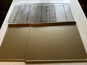 lot 396 image: Two Williams Sonoma Gold Touch Pro Baking Sheets and Three Gold Touch Cooling Racks