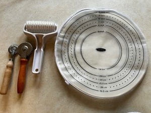 lot 409 image: OXO Silicone Dough Rolling Bag, Lattice Cutter, and Two Pastry Wheels