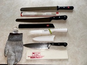 lot 419 image: Wustof General Super Slicer Knife, Pastry Knife, and Classic Knife and T-Fall Knife with Knife Glove