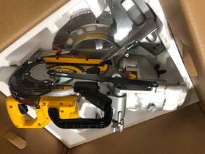 lot 1 image: DEWALT 20V MAX Cordless 7-14 in. Sliding Miter Saw with (1) 20V Battery 4.0Ah Customer Returns See Pictures