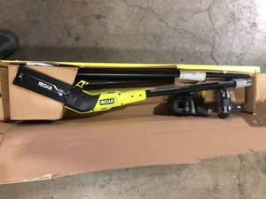 lot 19 image: RYOBI ONE 18V 8 in. Cordless Oil-Free Pole Saw with 1.5 Ah Battery and Charger  Customer Returns See Pictures