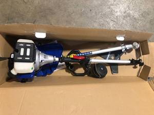 lot 43 image: WILD BADGER POWER 26 cc 2-Stroke 2-in-1 Gas Full Crank Straight Shaft Grass Trimmer with Brush Cutter Blade and Bonus Harness  Customer Returns See Pictures