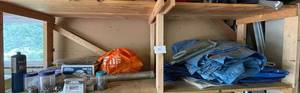 lot 31 image: Lot of Miscellaneous Garage Items Including Broan Roof Cap, Tarps, Nails, etc.