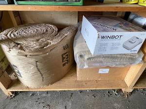 lot 33 image: Winbot Window Cleaning Robot, Roll of Insulation, Toy Train, Rug