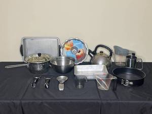 lot 71 image: Pots, Pans, MFG PKG Bunt Pan, Tea Kettle, Baking Pans, Measuring Cup, Mixing Bowls, Spoon Rest and More