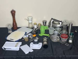 lot 79 image: Lot of Kitchen Accessories and Tools inc. Measuring Cups and Spoons, Salt and Pepper Shakers and Grinders, Cutting Boards, Sifters, and More