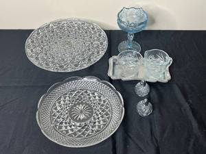 lot 89 image: Glass Cake Stand, Serving Platter, SugarCreamer Set on Tray, Salt and Pepper Shakers and Blue Tone Glass Pedestal Dish