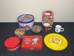 lot 93 image: Lot of Fun Holiday and Christmas TinsHard Plastic Canisters and Mugs