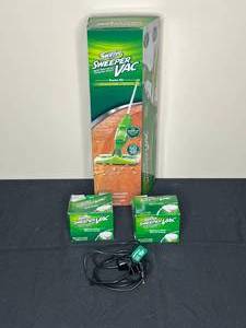 lot 97 image: Swiffer Sweeper Vac with 2 Packs of Replacement Filters