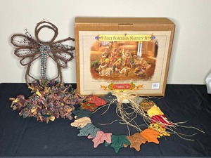 lot 107 image: Holiday Decorations Inc Fall Wreath & 9 Pc Porcelain Nativity Set in Box (all pcs unverified)
