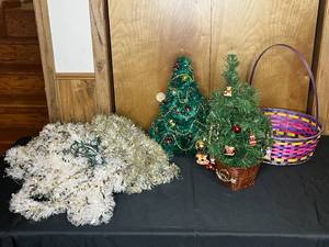lot 173 image: 2 Small Artificial Decorative Christmas Trees, Silver Garland, and an Easter Basket.