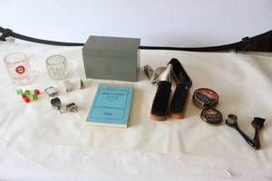 lot 572 image: Miscellaneous Knickknacks Shoe Shining Supplies, Dice, Lighters Etc.