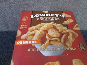 lot 335 image: 18- 1.75 oz Lowreys Pork Rinds...