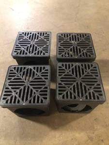 lot 26 image: NDS 9 in. Square Catch Basin Drain Kit 2-Opening Basin, Black Plastic Grate, 2 Outlet Adapters and 1 Outlet Plug (4-Pack)  Customer Returns See Pictures