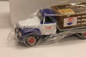 lot 40 image: 1951 Ford F-6 Full Rack Stake Truck  Pepsi-Cola Collectible Die-Cast Model