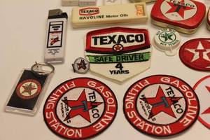 lot 63 image: Lot of Texaco Memorabilia Vintage Patches, Pins, Keychains, Lighters, and More