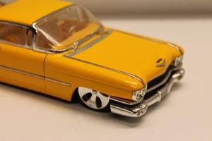 lot 220 image: Yellow Die-Cast Cadillac Model Car with Opening Hood and Doors