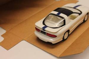 lot 351 image: 125 Scale 1994 Pontiac Trans Am Diecast Model - 25th Anniversary Edition in Arctic White by AMT