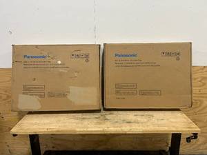 lot 143 image: PANASONIC Lot of 2- 27 in. Wide Trim Kits for Panasonics 1.6 cu. ft. Microwave Ovens in Stainless Steel
