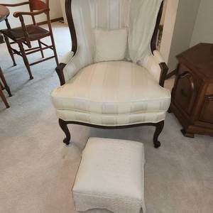 Cream and Wood Armchair with Footstool Measuring 29 Inches Wide x  29 Inches Deep x  and 38 Inches Tall