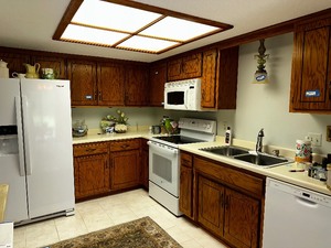 Kitchen Upper and Lower Cabinets, Counter top, Sink and Faucet Buyer To Remove. Items On Top Not Included