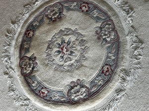 Round Wool Rug Measuring Approx. 36 Inches in Diameter