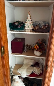 Ceramic Christmas Tree and Various Holiday Decor in Linen Closet - Nothing on the top shelf is included only what is shown in photos