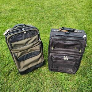lot 12 image: Two Rolling Suitcases Measuring 14 Inches By 23 Inches By 9 Inches