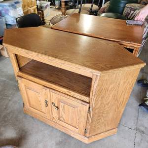 lot 15 image: Corner Solid Wood TV Stand Measuring 44 Inches Wide 17 Inches Deep And 31 Inches Tall