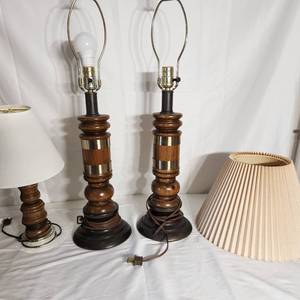 lot 22 image: Three Wooden And Metal Table Lamps Two Measuring 27 Inches Tall One Measuring 15 Inches Tall