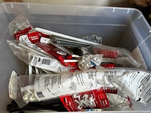 lot 126 image: Bin Of Miscellaneous Shelving Hardware with Brackets And Mounting Supplies