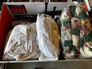 lot 58 image: Entire Lot Of Bedding, Including Comforter, Several Sets Of Sheets, Ranging From Twins To Queen, Twin Down Alternative Blanket, And Dust Ruffles
