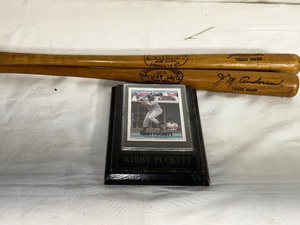 lot 290 image: Framed 1992 Donruss McDonalds Canada #21 Kirby Puckett Card Framed Plaque and Two Souvenier Louisville Slugger Bats