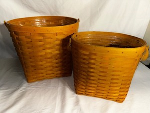 lot 202 image: Two Round Longaberger Baskets. One measuring 14 inches diameter and 12 inches tall and the other 11.5 inches x 9.5 inches x 10.5 inches