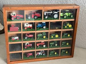 lot 93 image: Display Cabinet of Small Farm Tractors