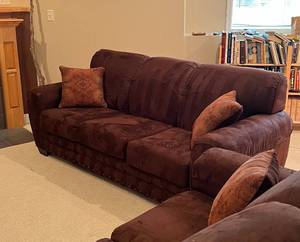 lot 65 image: Two Ashley Furniture Brown Microfiber Couches with 4 matching accent pillows 84 L x 37D x 36 H