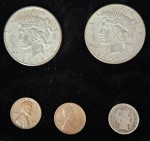 lot 107 image: Two 1923 Silver Peace Dollars, Both with San Francisco Mint Marks, One 1914 Mercury Dime, and Two Wheat Pennies