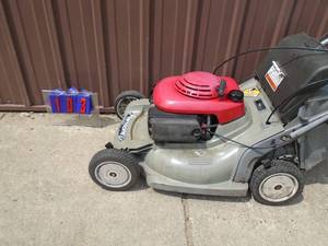 Honda push mower with bag. Good used condition. Tested & works. As shown.