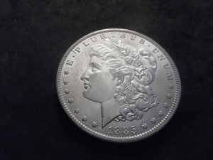 lot 13 image: 1885 O Morgan Silver Dollar