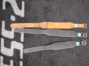 lot 86 image: (3) Leather weightlifting belts, 2 marked Harbinger