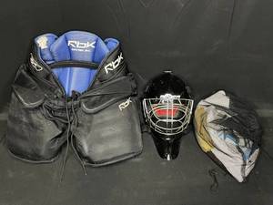 lot 22 image: Goalie Gear inc. Helmet (does not inc cert stickers for competition use), HPG RBK JR-L Breezers, and Mesh Bag of Accesories