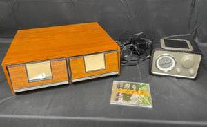 lot 45 image: Crosley Radio (black) and VTG Multi-Media Storage - Various Media Included