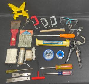 lot 54 image: Variety of Hand ToolsGarage Items inc Caulk Gun, TwinRope, Variety of Screw Drivers, C-Clamp, Safety Glasses and More