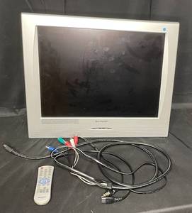 lot 56 image: Sharp TV w Cords and Remote - 19.5