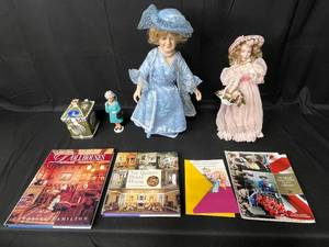lot 72 image: Lot of Queen Elizabeth II Decor and More inc. Vintage Show Stoppers Queen Mother Porcelain Doll w Stand, Franklin Heirloom Dainty Bess Porcelain Doll, Queen Elizabeth II Waving Figurine and Sadler Staffordshire Blarney Castle Teapot and More