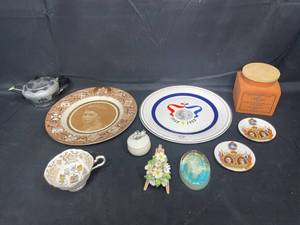 lot 103 image: VTG Queen Elizabeth II Canada Plate Clarice Cliff Royal Saffordshire Sepia Portrait, QEII 30th Anniversary Plate, Paragon China Canada Coats of Arms Tea Cup, Sandersons English Breakfast Tea Clock Tin and MORE