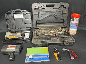 lot 87 image: Porter Cable Nail Gun, Craftsman Tool Set Box w Various Hand Tools Inside, Zipties, Hose Attachment, Fiskars Trimmers, Mitutoyo Tool, Wagon Tech Dynamo Spotlight and More
