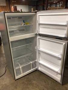 lot 28 image: Avanti Frost Free Top Freezer Refrigerator, 14.2 cu. ft., in Stainless Steel Finish Customer Returns damage See Pictures
