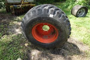 lot 141 image: Skid Steer Wheel with Firestone Tire